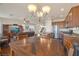 Open-concept kitchen and dining area with stainless steel appliances and wood cabinets, great for entertaining at 10548 Nantucket Ridge Ave, Las Vegas, NV 89166