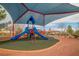 Community playground with modern play structure, shade, and safe play surface in a well-maintained environment at 10548 Nantucket Ridge Ave, Las Vegas, NV 89166