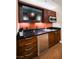 Kitchenette featuring wooden cabinets and stainless steel mini-fridge at 135 E Harmon Ave # 1919, Las Vegas, NV 89109