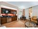 A kitchenette with wooden cabinets, a mini-fridge, and a sink at 135 E Harmon Ave # 1919, Las Vegas, NV 89109