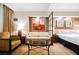 Sofa and table, wall art, and curtains define the living space at 145 E Harmon Ave # 2503, Las Vegas, NV 89109