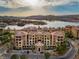 Stunning aerial view of the lakeside community and complex with mountain views in the distance at 15 Via Mantova # 303, Henderson, NV 89011