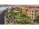 Aerial shot showcasing condos near a putting green, swimming pool, and lake at 15 Via Mantova # 303, Henderson, NV 89011