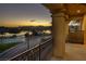 Balcony with distant lake and mountain views at sunset at 15 Via Mantova # 303, Henderson, NV 89011