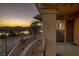 Balcony view of Lake Las Vegas at sunset, with a road and mountains visible in the distance at 15 Via Mantova # 303, Henderson, NV 89011