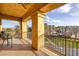Balcony with wrought iron railings, seating area, and community views at 15 Via Mantova # 303, Henderson, NV 89011
