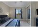 Comfortable bedroom featuring neutral walls, large window, carpet floors, and a mirrored closet at 15 Via Mantova # 303, Henderson, NV 89011