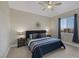 Comfortable bedroom featuring a ceiling fan and lots of natural light from the windows at 15 Via Mantova # 303, Henderson, NV 89011