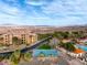 Aerial view of community showcasing pool, tennis courts and Mediterranean style condos at 15 Via Mantova # 303, Henderson, NV 89011