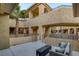 Inviting courtyard featuring comfortable seating, a modern fire pit, and views of the surrounding architecture at 15 Via Mantova # 303, Henderson, NV 89011