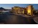 Illuminated entrance to a lakefront community with mountain views in the background at 15 Via Mantova # 303, Henderson, NV 89011