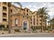 Elegant multi-story building with stunning architecture, manicured landscaping, and grand entrance at 15 Via Mantova # 303, Henderson, NV 89011
