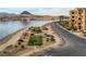 Scenic lakefront community featuring lush landscaping, walkways and beautiful desert mountain views at 15 Via Mantova # 303, Henderson, NV 89011