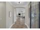 Bright foyer with archway leading to living spaces featuring tile floors and a decorative glass front door at 15 Via Mantova # 303, Henderson, NV 89011