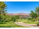 Scenic golf course with lush green fairways and mountain views in a desirable community at 15 Via Mantova # 303, Henderson, NV 89011