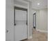 Laundry closet equipped with a stackable washer and dryer unit at 15 Via Mantova # 303, Henderson, NV 89011