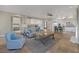 Open-concept living area with tile flooring, comfortable seating, and kitchen access at 15 Via Mantova # 303, Henderson, NV 89011