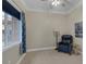 Cozy living room with a comfortable blue leather chair, lamp, side table, and neutral walls at 15 Via Mantova # 303, Henderson, NV 89011