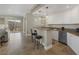 Open concept living space with a kitchen bar, custom cabinets and a balcony with a view at 15 Via Mantova # 303, Henderson, NV 89011