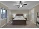 Spacious primary bedroom featuring carpet, a large window, and an ensuite bathroom at 15 Via Mantova # 303, Henderson, NV 89011