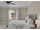 Bright bedroom with carpet, neutral walls, and a window with a view of the landscape at 15 Via Mantova # 303, Henderson, NV 89011