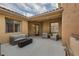 Cozy outdoor patio with stylish seating, fire pit, offering a relaxing space for gatherings and leisure at 15 Via Mantova # 303, Henderson, NV 89011
