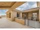 Inviting outdoor patio featuring cozy seating arrangements and a partial view of the surrounding landscape at 15 Via Mantova # 303, Henderson, NV 89011