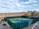 Well-maintained community pickleball courts set against a desert backdrop at 15 Via Mantova # 303, Henderson, NV 89011