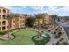 Lush community putting green and manicured grounds, surrounded by condos at 15 Via Mantova # 303, Henderson, NV 89011