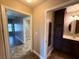 Bright bathroom featuring a vanity with storage and a tiled shower visible through an adjacent doorway at 1501 Lake Placid Ter # 0, Henderson, NV 89014