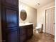 Bathroom with dark wood cabinets and modern fixtures at 1501 Lake Placid Ter # 0, Henderson, NV 89014