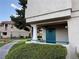 Exterior view of condo featuring an entry door, a green lawn, and a landscaped walkway at 1501 Lake Placid Ter # 0, Henderson, NV 89014