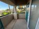 Outdoor patio with a view of the lush community landscaping, lake, and stucco pillar at 1501 Lake Placid Ter # 0, Henderson, NV 89014