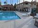 Community pool with plenty of lounge chairs and a covered cabana perfect for sunbathing at 1501 Lake Placid Ter # 0, Henderson, NV 89014