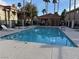 Relaxing community pool area featuring lounge chairs and a gated fence, ideal for leisure at 1501 Lake Placid Ter # 0, Henderson, NV 89014