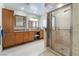 Luxurious bathroom with a double vanity, granite countertops, and a glass-enclosed shower at 1744 Marshall Dr, Henderson, NV 89014