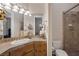 Bathroom featuring tiled counter, a shower with tile surround, and an enclosed toilet at 1901 Rosemere Ct, Las Vegas, NV 89117