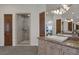 Bathroom features a walk in shower and seperate vanity with a door leading to another room at 1901 Rosemere Ct, Las Vegas, NV 89117