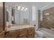 Bathroom features a tiled counter, a shower, an enclosed toilet, and natural lighting at 1901 Rosemere Ct, Las Vegas, NV 89117