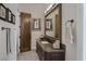 Bathroom with granite countertop, framed mirror, decorative sconces, and stylish design at 1901 Rosemere Ct, Las Vegas, NV 89117