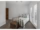 Bedroom featuring a wrought iron bed frame, and a small trunk used as decor at 1901 Rosemere Ct, Las Vegas, NV 89117