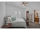 Bedroom features a wrought iron bed frame, french doors, and ensuite access at 1901 Rosemere Ct, Las Vegas, NV 89117
