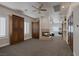 Spacious bedroom with a fireplace, plantation shutters, and a ceiling fan at 1901 Rosemere Ct, Las Vegas, NV 89117
