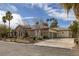 Spacious three-car garage and stone accents highlight the exterior at 1901 Rosemere Ct, Las Vegas, NV 89117