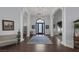 Grand foyer boasts elegant lighting, high ceilings, and hardwood flooring at 1901 Rosemere Ct, Las Vegas, NV 89117