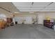 Spacious garage with storage cabinets, overhead lighting, and epoxy flooring offers ample space at 1901 Rosemere Ct, Las Vegas, NV 89117