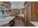 Kitchen featuring stainless steel appliances, custom cabinetry, and marble countertops at 1901 Rosemere Ct, Las Vegas, NV 89117