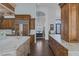 Spacious open concept kitchen with custom cabinetry, marble countertops, and stainless steel appliances at 1901 Rosemere Ct, Las Vegas, NV 89117