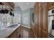 Kitchen with an island cooktop, custom cabinetry, and stainless steel appliances at 1901 Rosemere Ct, Las Vegas, NV 89117