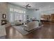 Open living space with fireplace, hardwood floors, and large windows that offer plenty of natural light at 1901 Rosemere Ct, Las Vegas, NV 89117